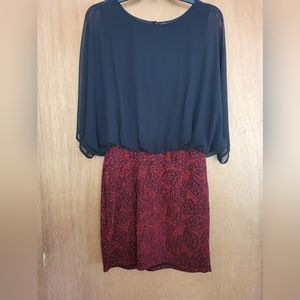 Kimcine cocktail dress. Black sheer bat sleeves, sparkle fitted red skirt. Large